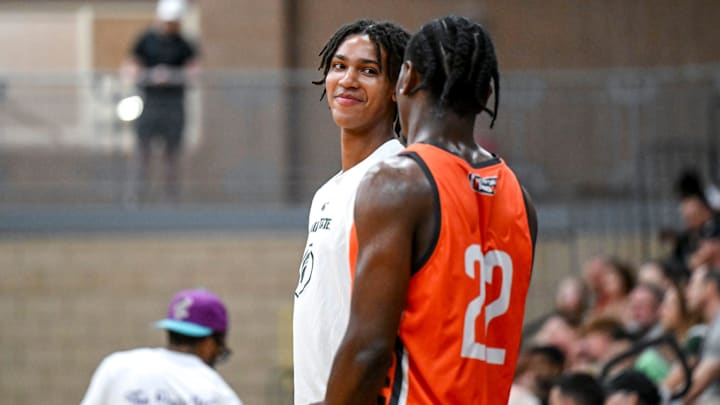 Michigan State's Jordan Scott, left, talks with MSU and Team Snipes teammate Trey Fort during the Moneyball Pro-Am on Tuesday, June 24, 2025, at Holt High School.