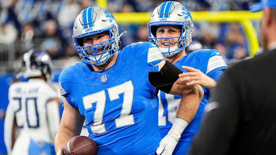 Detroit Lions quarterback Jared Goff (16) talks to center Frank Ragnow (77) during warm up before the Tennessee Titans game at Ford Field in Detroit on Sunday, Oct. 27, 2024. | Junfu Han / USA TODAY NETWORK via Imagn Images
