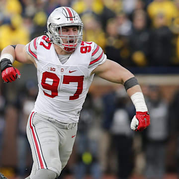 Ohio State Buckeyes defensive lineman Joey Bosa (97) celebrates sacking Michigan Wolverines quarterback Jake Rudock (15) during the fourth quarter of the NCAA football game at Michigan Stadium in Ann Arbor on Nov. 28, 2015. Ohio State won 42-13. (Adam Cairns / The Columbus Dispatch)