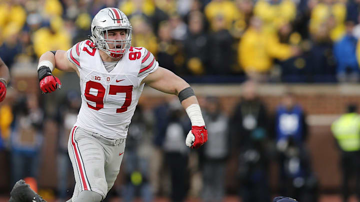 Ohio State Buckeyes defensive lineman Joey Bosa (97) celebrates sacking Michigan Wolverines quarterback Jake Rudock (15) during the fourth quarter of the NCAA football game at Michigan Stadium in Ann Arbor on Nov. 28, 2015. Ohio State won 42-13. (Adam Cairns / The Columbus Dispatch)