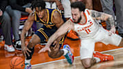 Cal's Jeremiah Wilkinson, left, and Clemson's Jaeden Zachery dive for a loose ball.