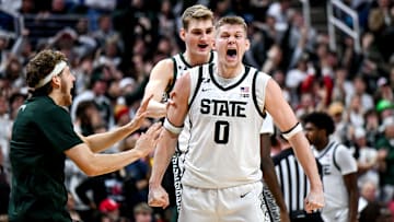 Michigan State's Jaxon Kohler, right, celebrates with teammates Carson Cooper, center, and Gehrig Normand, left