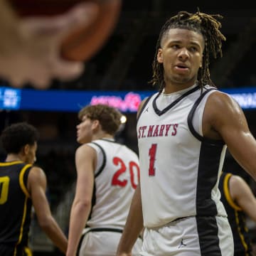 Orchard Lake St. Marys Trey McKenney looks at his teammate Trenten Bolhouse during the MHSAA Div. 1 state finals against North Farmington at the Breslin Center in East Lansing on Saturday, March 16, 2024.