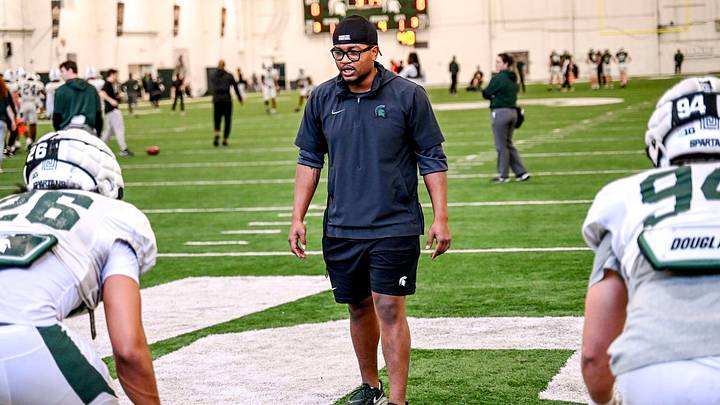 Michigan State assistant defensive line coach Antjuan Simmons works with players during football practice on Tuesday, April 8, 2025, in East Lansing.