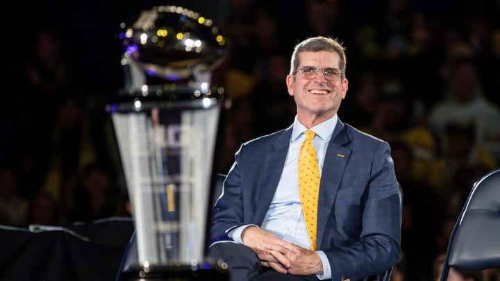 Jim Harbaugh looks on during Michigan's national championship celebration.