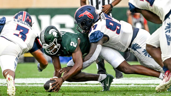 Michigan State's Aidan Chiles recovers a fumble against Florida Atlantic during the first quarter on Friday, Aug. 30, 2024, at Spartan Stadium in East Lansing.