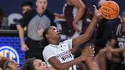 Mar 1, 2023; Greenville, SC, USA; Mississippi State guard Debreasha Powe (21) reaches for a rebound near Texas A&M forward Aaliyah Patty (32) during the first quarter of the SEC Women's Basketball Tournament at Bon Secours Wellness Arena. Mandatory Credit: Ken Ruinard-Imagn Images