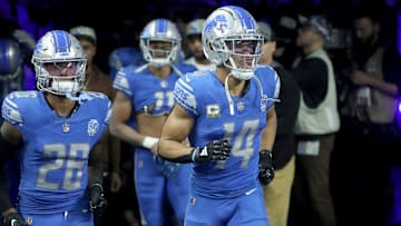 Detroit Lions receiver Amon-Ra St. Brown (14) and running back Jahmyr Gibbs (26) take the field before action against the Chicago Bears at Ford Field, Sunday, Nov. 19, 2023.
