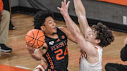 Feb 14, 2024; Clemson, South Carolina, USA;  Miami guard Nijel Pack (24) shoots the ball near Clemson junior forward PJ Hall (24) during the first half at Littlejohn Coliseum Wednesday, February 14, 2024. 