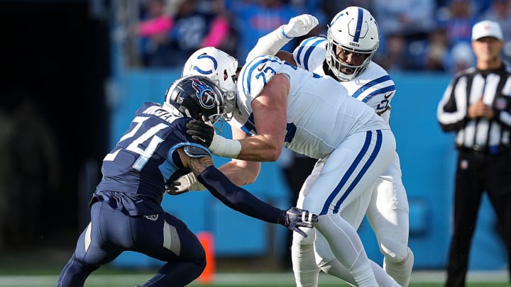 Tennessee Titans cornerback Elijah Molden (24) tries to navigate around Indianapolis Colts offensive tackle Blake Freeland (73) but is unable to get the first down Sunday, Dec. 3, 2023, at Nissan Stadium in Nashville, Tenn.