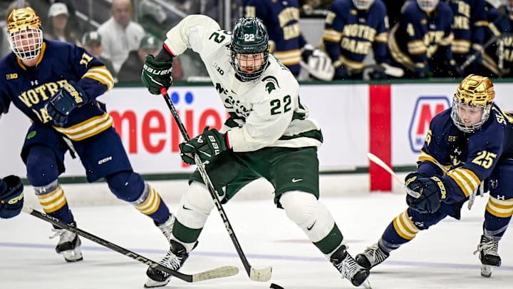 Michigan State's Isaac Howard moves the puck against Notre Dame during the second period in the Big Ten tournament on Saturday, March 15, 2025, at Muni Arena in East Lansing. Michigan State's Isaac Howard moves the puck against Notre Dame during the second period in the Big Ten tournament on Saturday, March 15, 2025, at Muni Arena in East Lansing.