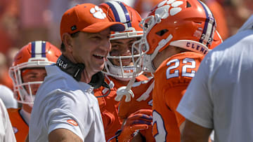 Sep 21, 2024; Clemson, South Carolina, USA; Clemson Tigers wide receiver Cole Turner (22) celebrates with head coach Dabo Swinney after scoring a touchdown against the North Carolina State Wolfpack during the second quarter at Memorial Stadium. Mandatory Credit: Ken Ruinard-Imagn Images