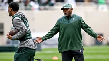 Michigan State's Michigan State's wide receivers coach Courtney Hawkins, right, talks with Jaden Mangham during the Spring Showcase on Saturday, April 20, 2024, at Spartan Stadium in East Lansing.
