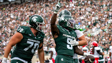 Michigan State's Makhi Frazier, center, celebrates his touchdown against Youngstown State during the second quarter on Saturday, Sept. 13, 2025, at Spartan Stadium in East Lansing.