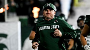 Michigan State's head coach Jonathan Smith runs onto the field with the team before the gam against Michigan Saturday, Oct. 25, 2025, at Spartan Stadium in East Lansing.
