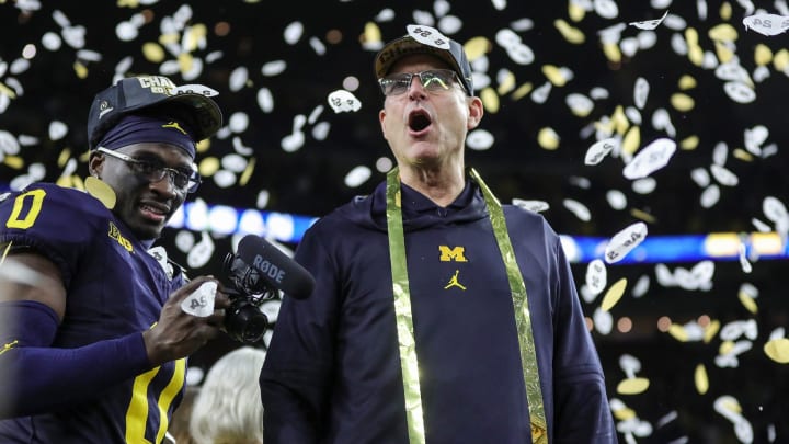 Michigan head coach Jim Harbaugh celebrates during the trophy presentation after the 34-13 win over Washington at the national championship game at NRG Stadium in Houston on Monday, Jan. 8, 2024.