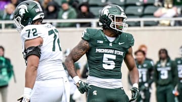 Michigan State's Jordan Hall, right, celebrates after a play during the Spring Showcase on Saturday, April 20, 2024, at Spartan Stadium in East Lansing.
