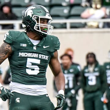 Michigan State's Jordan Hall, right, celebrates after a play during the Spring Showcase on Saturday, April 20, 2024, at Spartan Stadium in East Lansing.