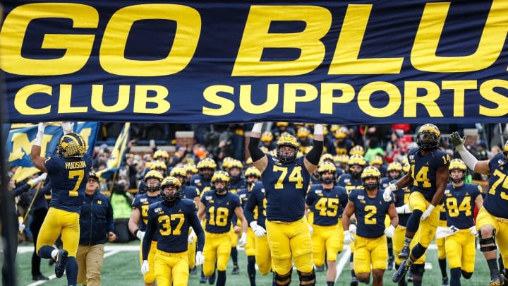 Michigan players jump up to touch the banner as they take the field for the Ohio State game at Michigan Stadium, Saturday, Nov. 30, 2019.

Go Blue Michigan Flag