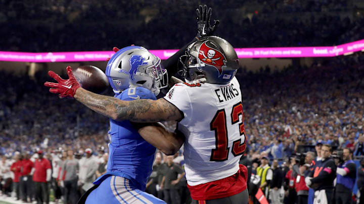 Detroit Lions safety Ifeatu Melifonwu (6) stops Tampa Bay Buccaneers receiver Mike Evans (13)