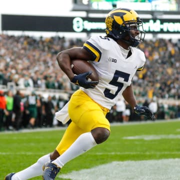 Michigan wide receiver Mike Sainristil scores a touchdown against Michigan State during the second half at Spartan Stadium in East Lansing on Saturday, Oct. 30, 2021.