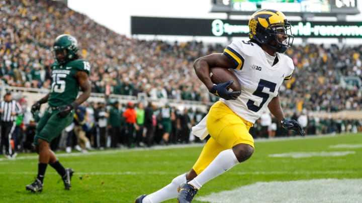 Michigan wide receiver Mike Sainristil scores a touchdown against Michigan State during the second half at Spartan Stadium in East Lansing on Saturday, Oct. 30, 2021.