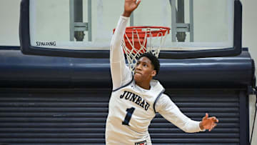 Milwaukee Juneau guard Dooney Johnson (1) elevates to block a shot against Milwaukee Hamilton in a game Friday, January 17, 2025, at MacDowell Montessori School in Milwaukee, Wisconsin.