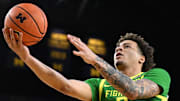 Feb 5, 2025; Ann Arbor, Michigan, USA;  Oregon Ducks guard Jadrian Tracey (2) scores off a steal against the Michigan Wolverines in the second half at Crisler Center. Mandatory Credit: Lon Horwedel-Imagn Images