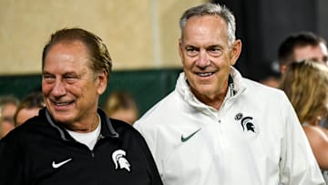 Former Michigan State head coach Mark Dantonio, right, and Tom Izzo stand on the sidelines after Dantonio was recognized for his induction to the National Football Foundation Hall of Fame and for his addition to the the Spartans Ring of Fame during MSU's game against Ohio State on Saturday, Sept. 28, 2024, at Spartan Stadium in East Lansing.