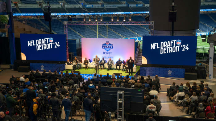 Wayne County Executive Warren C. Evans takes the stage during a news conference at Ford Field on