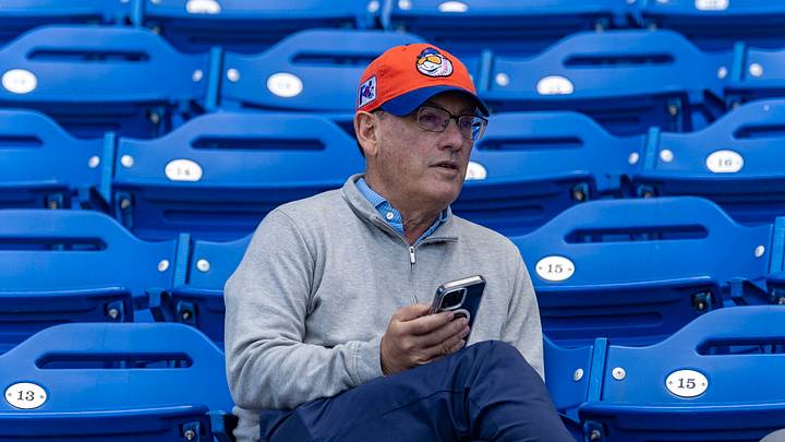 New York Mets owner Steve Cohen sitting in stands during spring training