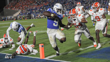 Sep 4, 2023; Durham, North Carolina, USA; Duke Blue Devils running back Jaquez Moore (9) scores near Clemson linebacker Jeremiah Trotter Jr. (54) during the fourth quarter of the season opening game at Wallace Wade Stadium in Durham, N.C. Mandatory Credit: Ken Ruinard-USA TODAY Sports