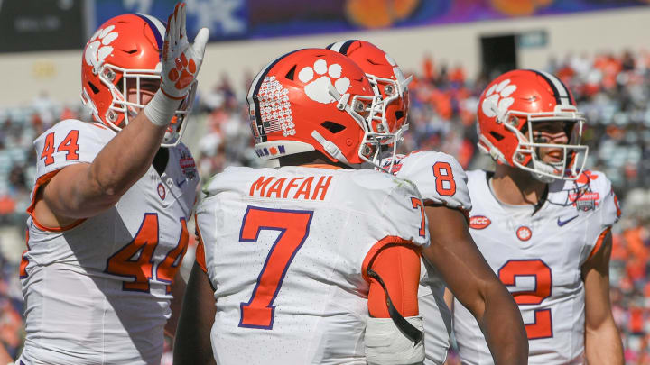 Clemson running back Phil Mafah (7) scored against Kentucky during the second quarter of the TaxSlayer Gator Bowl at EverBank Stadium in Jacksonville, Florida, Friday, December 29, 2023.