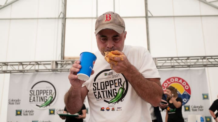 Geoffrey Esper forces down one of 34 sloppers to take the title at the 2021 World Slopper Eating Championship during the Colorado State Fair on Saturday September 4, 2021.

Slopper Contest Geoffrey Esper