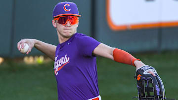 Clemson sophomore Cam Cannarella (10) returns a ball to the infield during practice at Doug Kingsmore Stadium in Clemson, S.C. Tuesday, February 13, 2024.
