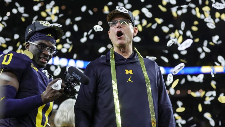 Michigan head coach Jim Harbaugh celebrates during the trophy presentation after the 34-13 win over Washington at the national championship game at NRG Stadium in Houston on Monday, Jan. 8, 2024.