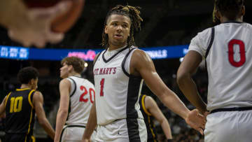 Orchard Lake St. Marys Trey McKenney looks at his teammate Trenten Bolhouse during the MHSAA Div. 1 state finals against North Farmington at the Breslin Center in East Lansing on Saturday, March 16, 2024.