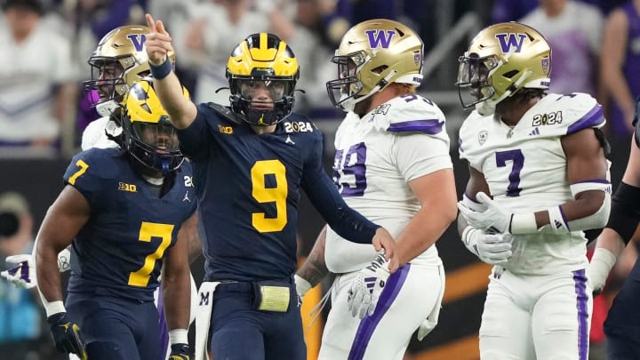 Michigan quarterback J.J. McCarthy points down the field during the second half of the College Football Playoff national championship game against Washington at NRG Stadium in Houston, Texas on Monday, Jan. 8, 2024.