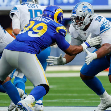 Detroit Lions offensive tackle Penei Sewell sets up to block Los Angeles Rams defensive end Aaron Donald during the second half at SoFi Stadium in Inglewood, Calif. on Sunday, Oct. 24, 2021.