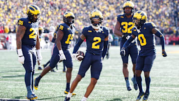 Michigan defensive back Will Johnson celebrates after intercepting a pass vs. Ohio State during the first quarter at Michigan Stadium in Ann Arbor on Saturday, Nov. 25, 2023.