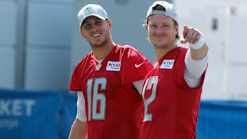 Detroit Lions quarterback Jared Goff, left, and former QB Tim Boyle walk off the field after training camp at the Allen Park facility during 2021 training camp. 