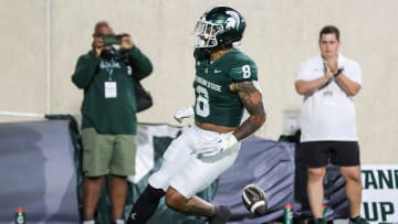 Michigan State running back Jalen Berger (8) scores a touchdown against Central Michigan during the