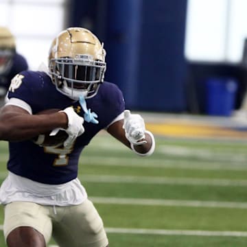 Notre Dame running back Jeremiyah Loves runs with the ball after making a catch during a drill in practice Saturday, April 5, 2025, at the Irish Athletics Center in South Bend.