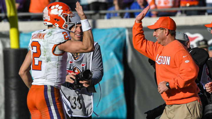 Clemson quarterback Cade Klubnik (2) gives a high five to Head Coach Dabo Swinney after the TaxSlayer Gator Bowl at EverBank Stadium in Jacksonville, Florida, Friday, December 29, 2023. Clemson beat Kentucky 38-35.