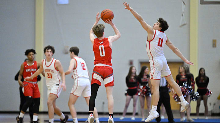 Zach Wolinski of North Andover attempts a block on this shot by Brendan Wilder of Waltham during the MIAA Division 1 state tournament basketball game at North Andover High School on Saturday, March 11, 2023. North Andover defeated Waltham 47-46.

11453198002p Ma Nan Boysbasketball2ds