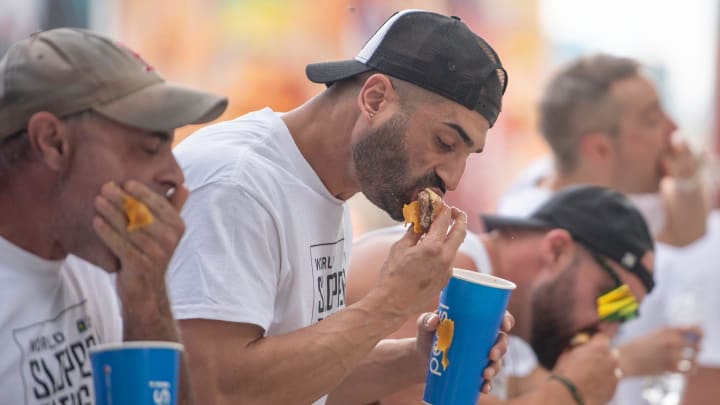 James Webb, center, is one of the top contenders for this year's hot dog eating contest. 