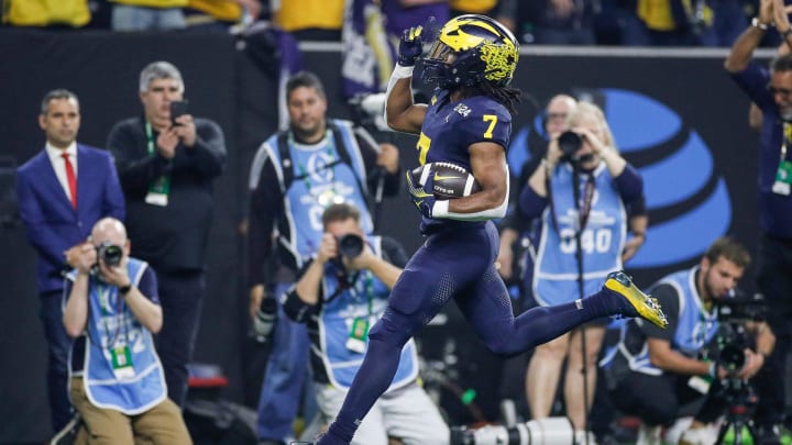 Michigan running back Donovan Edwards runs for a touchdown against Washington during the first half of the national championship game at NRG Stadium in Houston, Texas on Monday, Jan. 8, 2024.