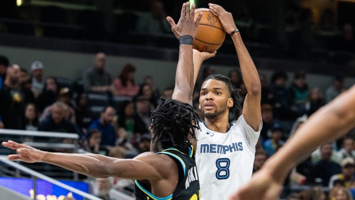 Jan 28, 2024; Indianapolis, Indiana, USA; Memphis Grizzlies forward Ziaire Williams (8) shoots the ball while Indiana Pacers forward Aaron Nesmith (23) defends in the first half at Gainbridge Fieldhouse. Mandatory Credit: Trevor Ruszkowski-USA TODAY Sports