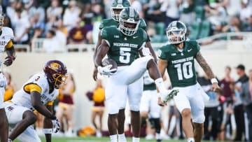 Michigan State running back Nathan Carter (5) celebrates his 31-yard run on the first offensive play of the season against Central Michigan at Spartan Stadium in East Lansing on Friday, Sept. 1, 2023.