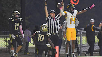 Crescent High sophomore Amiri Acker (14) scores near Pendleton junior Jemarai Johnson (10) during the second quarter at Cunningham Stadium in Pendleton, S.C. Friday, October 13, 2023.